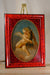 Putto in tortoise frame II