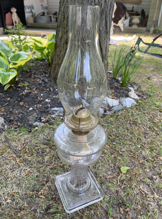 Glass Oil Lamp #1016 and antique item.
