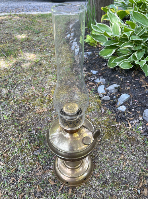 Brass oil lamp #1018 and antique item.