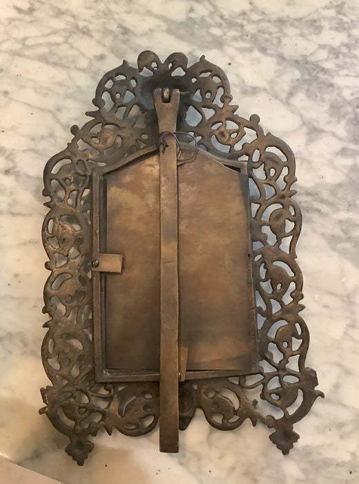 Bronze picture frame and antique item.
