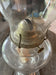 Glass Oil Lamp #1016 and antique item.